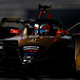 A DS Techeetah Formula E car races round a track.